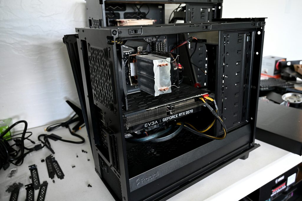 Technician repairing a desktop PC in Chichester